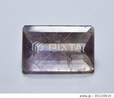 Natural yellow and purple ametrine on the white background 85220619