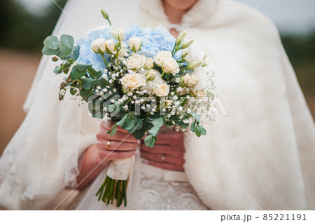 Bouquet of flowers in the hand of the bride Bouquet of flowers in the hand of the bride 85221191