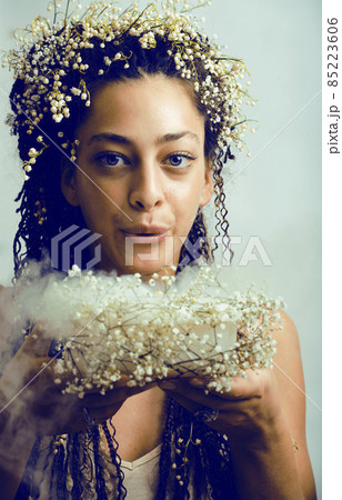 young pretty brunette girl with bouquet of little white spring flowers, lifestyle people concept 85223606