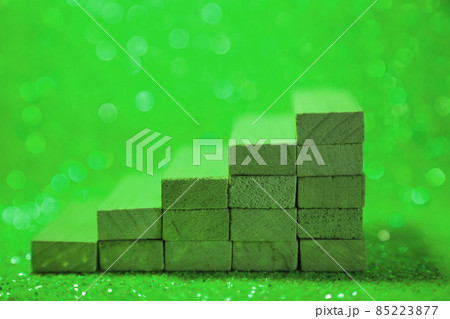 Podium for product presentation. Minimalistic staircase made of wooden cubes. A scene with geometric shapes. On a shiny green background. High quality photo Podium for product presentation. Minimalistic staircase made of wooden cubes. A scene with geometric shapes. On a shiny green background. High quality photo 85223877
