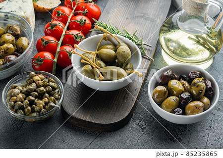 Mediterranean olives and capers, on gray background 85235865