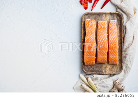 Raw salmon meat for cutlet, on white textured background, top view with space for text Raw salmon meat for cutlet, on white textured background, top view with space for text 85236055
