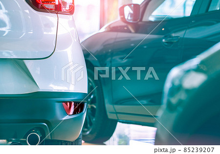 Selective focus white car parked in luxury showroom. Car dealership office. New car parked in modern showroom. Car for sale and rent business concept. Automobile leasing and insurance background. 85239207