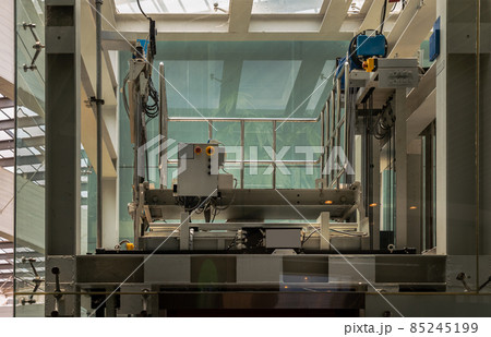 Elevator engine glass room with elevator motor. Motor driven Elevator cable control room. Wire Rope cable control the elevator. Elevator engine glass room with elevator motor. Motor driven Elevator cable control room. Wire Rope cable control the elevator. 85245199
