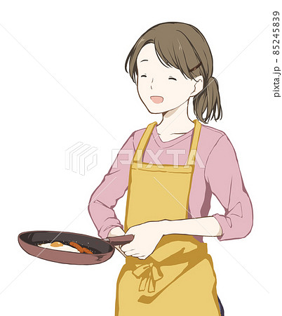 フライパンで料理をする女性(にっこり笑顔) フライパンで料理をする女性(にっこり笑顔) 85245839