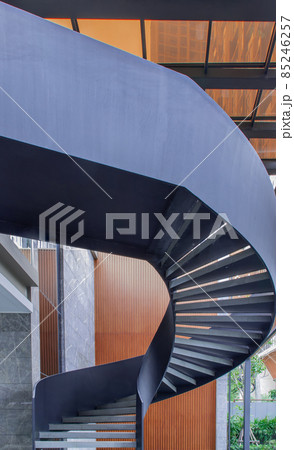 Side view of a spiral staircase pattern. Spiral stairs circle in courtyard architecture. Outdoor ladder decoration interior. Side view of a spiral staircase pattern. Spiral stairs circle in courtyard architecture. Outdoor ladder decoration interior. 85246257