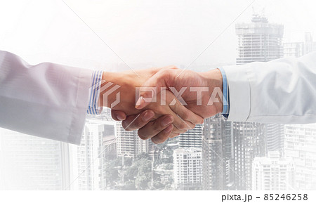 Close-up of the handshake between the two medics. Close-up of the handshake between the two medics. 85246258