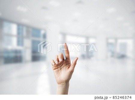 Choosing gesture of person in elegant modern interior in sunshine light 85246374