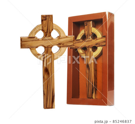 Wooden crucifix standing on white background Wooden crucifix standing on white background 85246837
