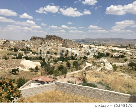 Cappadocia is not only hot air balloons, but also beautiful landscapes of houses in rocks and greenery. Cappadocia, magic music frozen in stone. 85248170