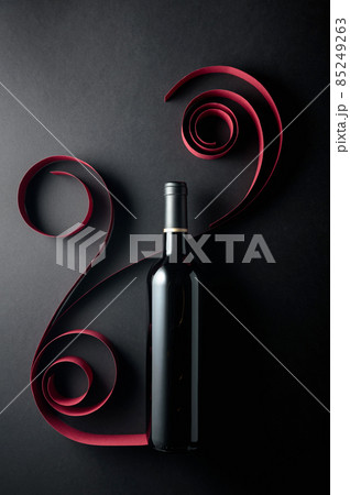 Bottle of red wine on a black background. Bottle of red wine on a black background. 85249263