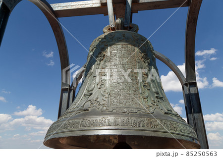 Orthodox bells closeup against the sky with clouds.  New Jerusalem in town Istra, surroundings of Moscow, Russia. 85250563