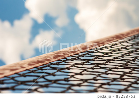 a tennis net against the blue sky 85253753