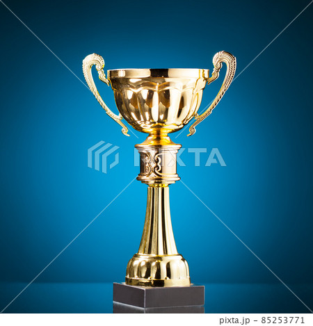 gold cup trophy on blue background gold cup trophy on blue background 85253771