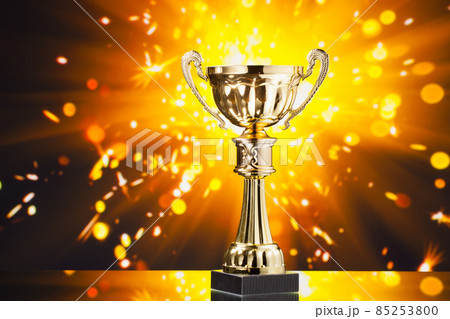 gold cup trophy against shiny sparks background gold cup trophy against shiny sparks background 85253800