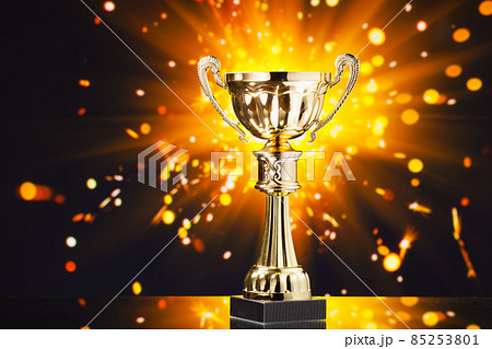 gold cup trophy against shiny sparks background gold cup trophy against shiny sparks background 85253801