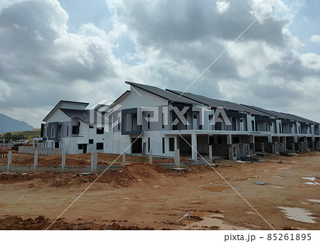 SEREMBAN, MALAYSIA -APRIL 16, 2020: Selected focused on new double story terrace house under construction in Malaysia. Designed by an architect with a modern and contemporary style. SEREMBAN, MALAYSIA -APRIL 16, 2020: Selected focused on new double story terrace house under construction in Malaysia. Designed by an architect with a modern and contemporary style. 85261895