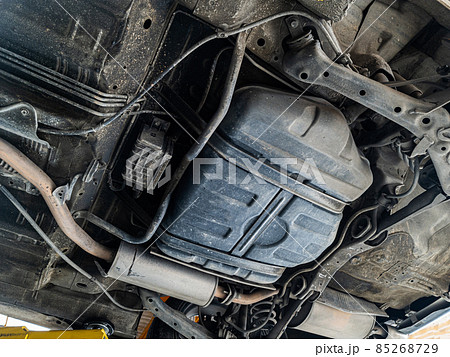 Lifting car engine and suspension system awaiting maintenance in garage Lifting car engine and suspension system awaiting maintenance in garage 85268729