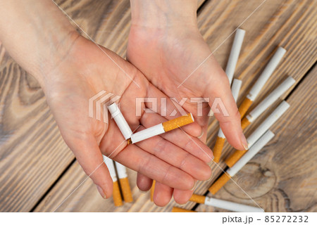 Quit smoking cigarette concept. The woman quits smoking cigarettes. Quit bad habit, health care concept. No smoking Quit smoking cigarette concept. The woman quits smoking cigarettes. Quit bad habit, health care concept. No smoking 85272232