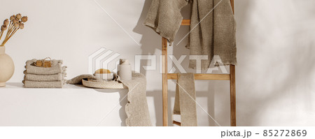 Organic handmade soap on waffle linen towel and beige soap dispenser. Bathroom zero waste accessories. Daily body care, spa and wellness zero waste bathroom concept 85272869