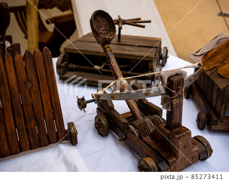 small wooden catapult model, miniature reproduction of medieval siege weapon small wooden catapult model, miniature reproduction of medieval siege weapon 85273411