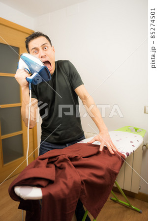 Man who does not know how to iron clothes. Man who does not know how to iron clothes. 85274501