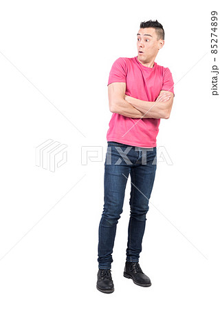 Astonished man with crossed arms. White background Astonished man with crossed arms. White background 85274899