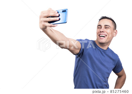 Man taking a selfie while laughing to the camera Man taking a selfie while laughing to the camera 85275460