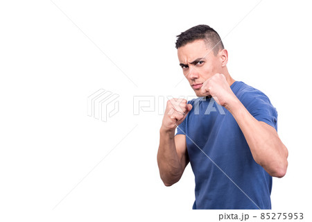 Man in casual clothes in boxing guard Man in casual clothes in boxing guard 85275953