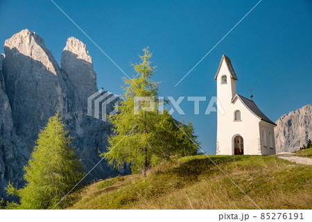 Chapel with mountain view in background, Passo Gardena Dolomite Mountains Italy 85276191