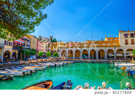 Old harbour Porto Vecchio with motor boats on turquoise water 85277809