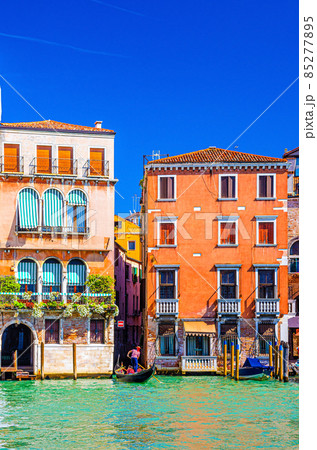 Grand Canal waterway in Venice historical city centre with gondolier on sailing gondola Grand Canal waterway in Venice historical city centre with gondolier on sailing gondola 85277895