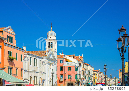 Chiesa di San Francesco catholic church and row of colorful multicolored buildings in Chioggia Chiesa di San Francesco catholic church and row of colorful multicolored buildings in Chioggia 85278095