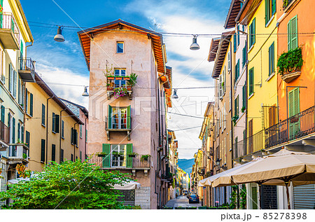 Traditional colorful building with balconies, shutter windows and multicolored walls Traditional colorful building with balconies, shutter windows and multicolored walls 85278398