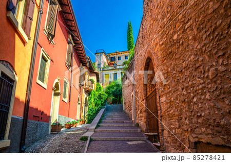 Staircase stairway of narrow street between stone walls 85278421