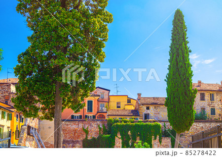 Typical old colorful houses and traditional italian multicolored buildings with tiled roofs 85278422