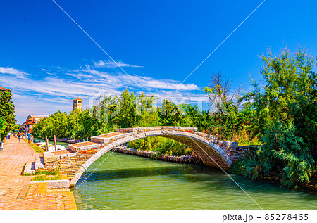Stone Devil bridge across water canal on Torcello island Stone Devil bridge across water canal on Torcello island 85278465
