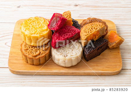 colourful Chinese moon cake on wood plate colourful Chinese moon cake on wood plate 85283920