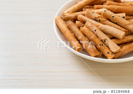 crispy coconut roll on plate crispy coconut roll on plate 85284068