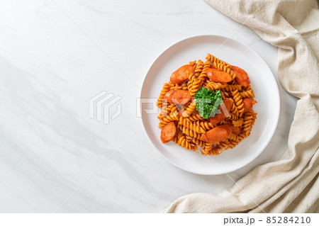 spirali or spiral pasta with tomato sauce 85284210