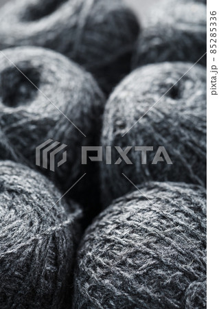 Gray yarn made of natural wool in balls of thread. Gray yarn made of natural wool in balls of thread. 85285336