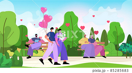 loving couple celebrating happy valentines day in park man woman in love standing together with flowers and pink air balloons 85285683