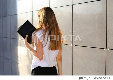 Woman browsing tablet in business center 85287814