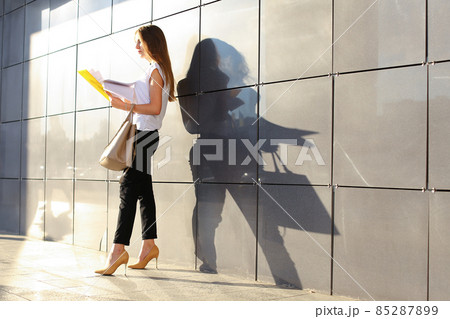 Business woman girl work business center look at documents Business woman girl work business center look at documents 85287899