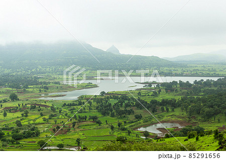 View of Tringalwadi irrigation dam backwaters and fields, Nashik, Maharashtra, India. View of Tringalwadi irrigation dam backwaters and fields, Nashik, Maharashtra, India. 85291656