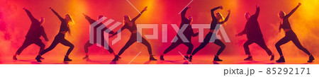Collage of young couple, boy and girl dancing hip-hop isolated over gradient pink yellow background in neon 85292171