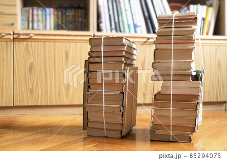 two stacks of used books tied with packthread two stacks of used books tied with packthread 85294075