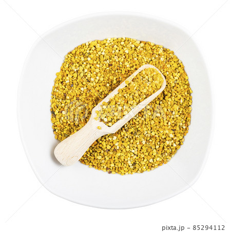 top view of ceramic bowl with scoop and bee pollen top view of ceramic bowl with scoop and bee pollen 85294112