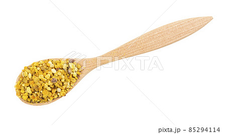 spoon with portion of natural bee polen isolated 85294114