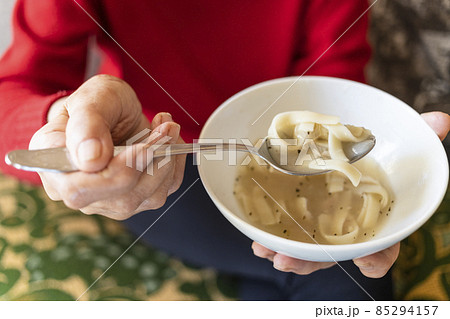 above view of bowl with noodle soup in hand above view of bowl with noodle soup in hand 85294157